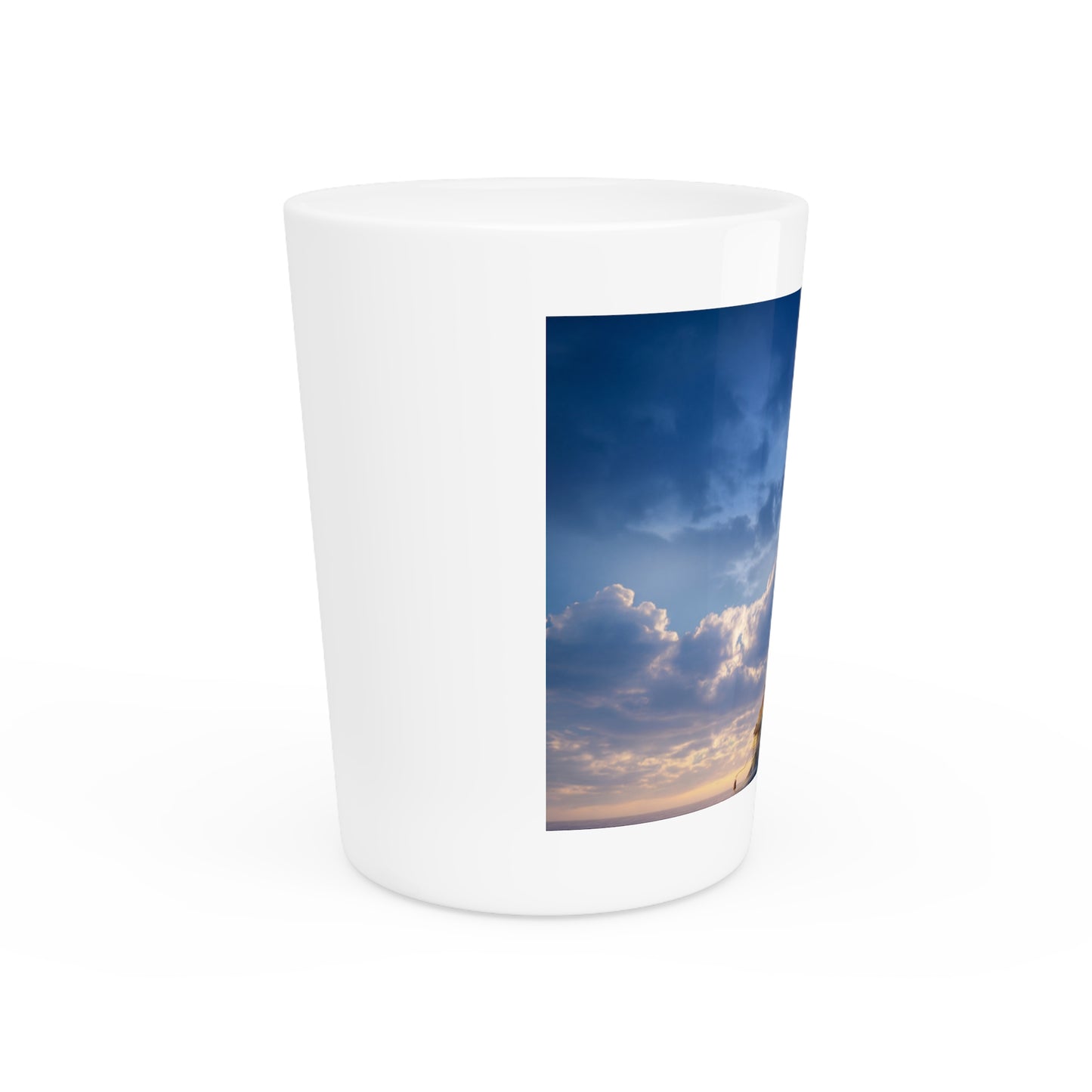 Skyborne Lighthouse Shot Glass – Warm Light Against the Azure Expanse