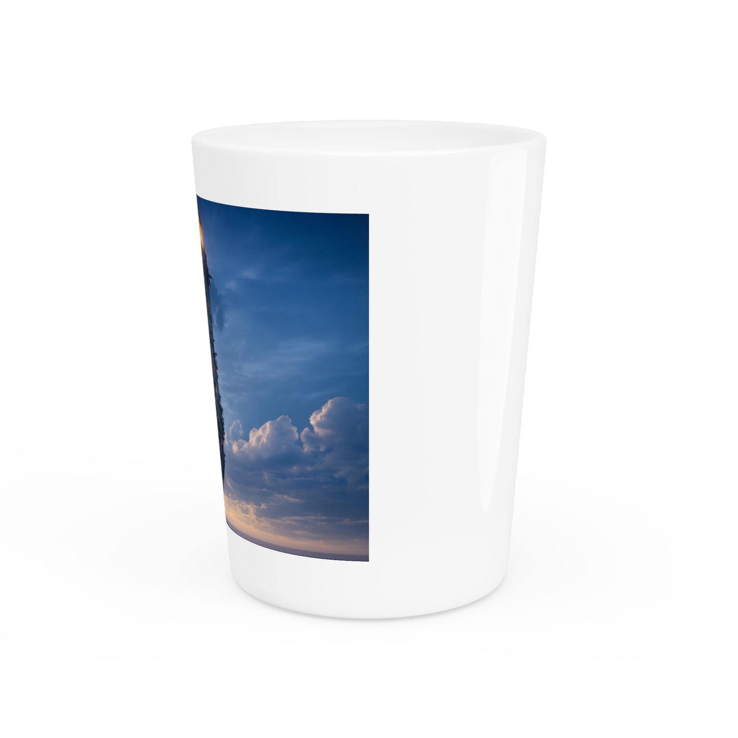 Skyborne Lighthouse Shot Glass – Warm Light Against the Azure Expanse