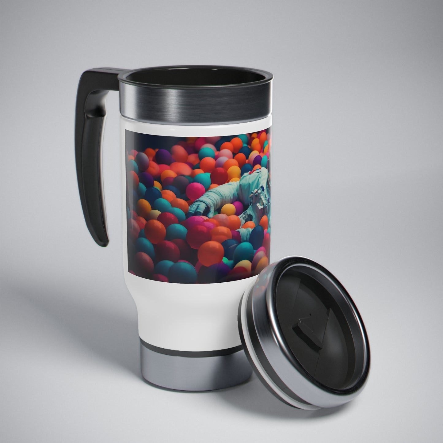 a realistic of photography astronaut lying in colourful balls pool - Stainless Steel Travel Mug with Handle, 14oz