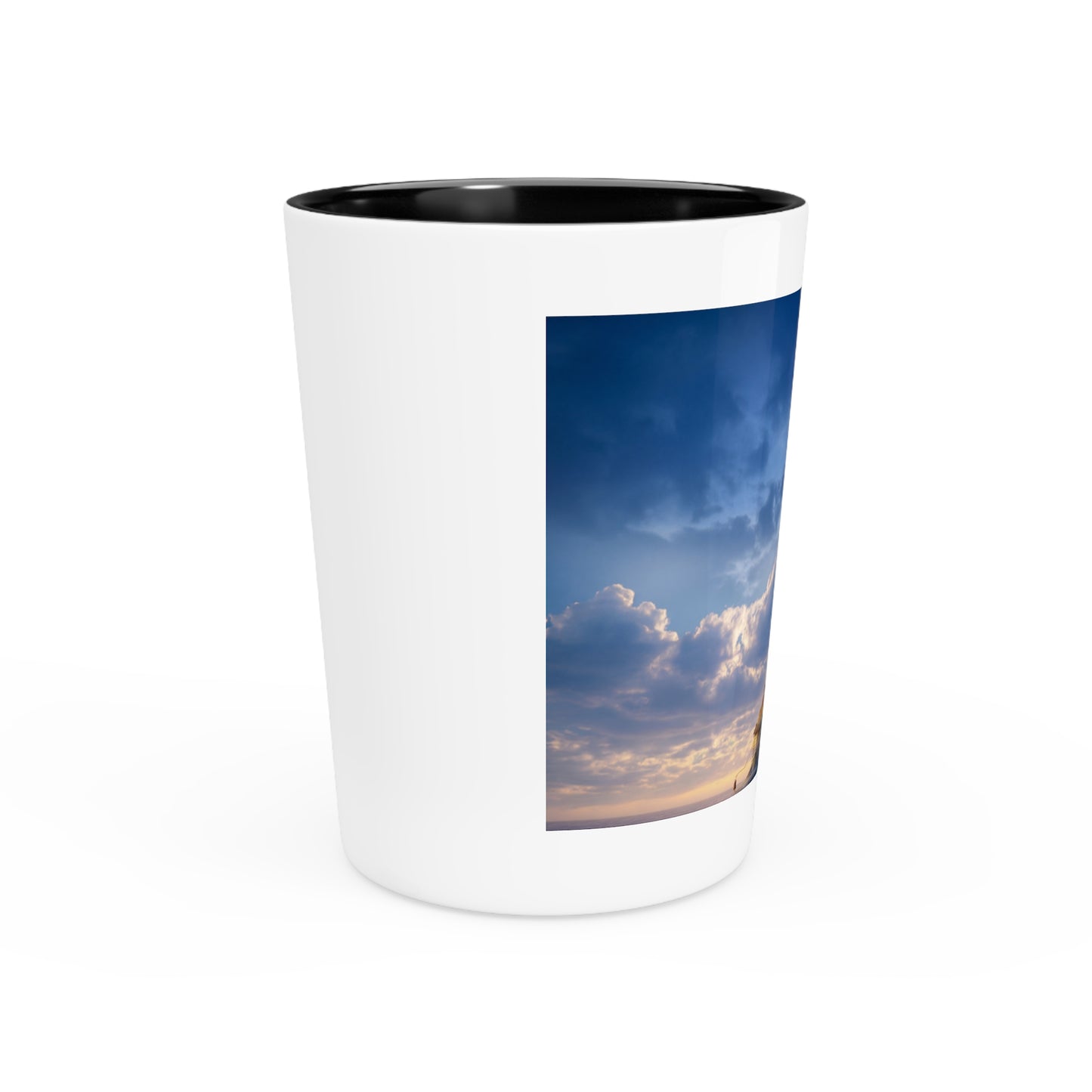 Skyborne Lighthouse Shot Glass – Warm Light Against the Azure Expanse