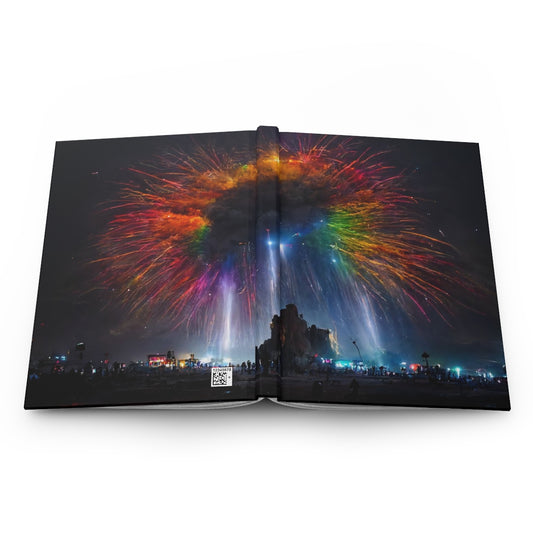 giant rainbow fireworks exploding in the sky, black rock city in the background, lasers and lights illuminating dust, last star in an early morning sky, crowds of people dancing below - Hardcover Journal Matte